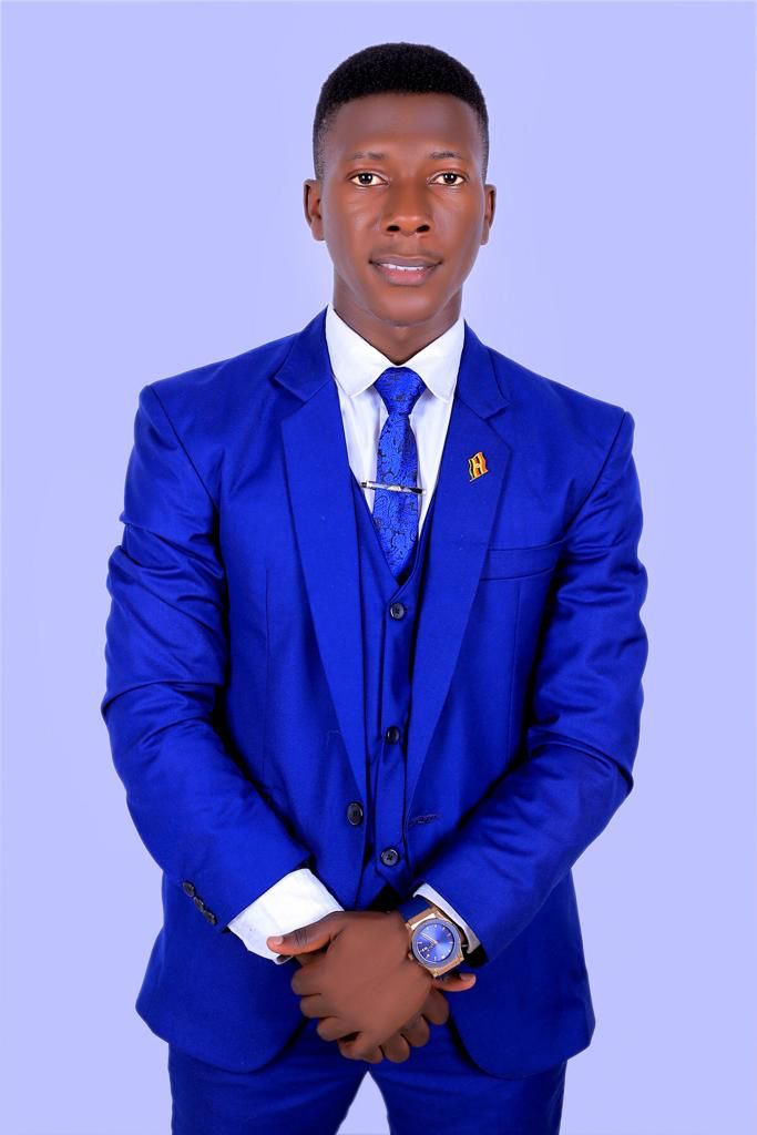 Ahumuza Innocent in a professional blue suit